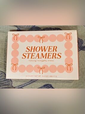 Spritz Shower Steamers in Pink and Orange Packaging
